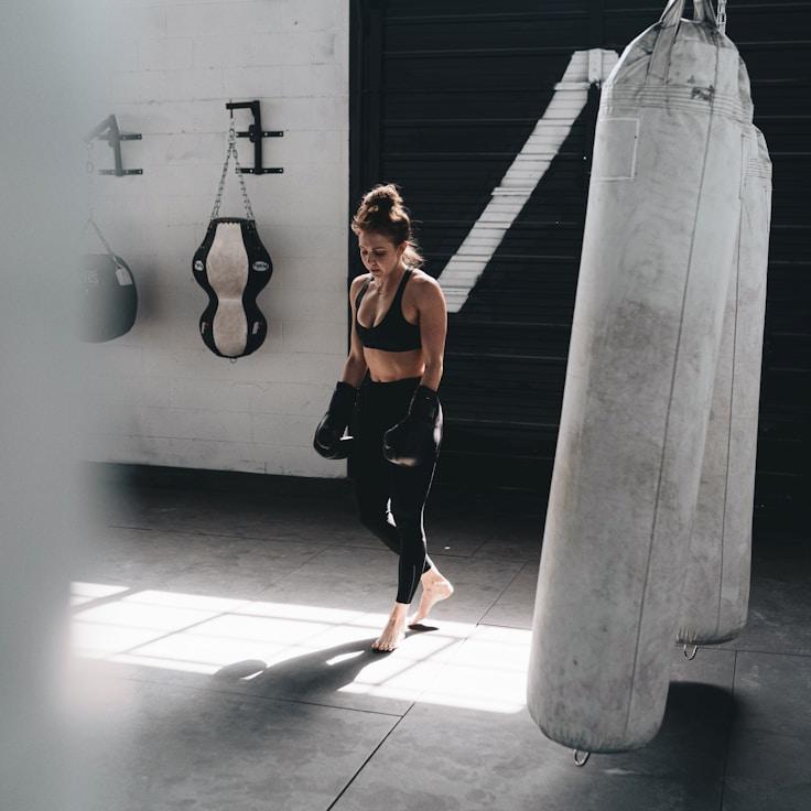 Women in a fitness class doing stretching and mobility exercises